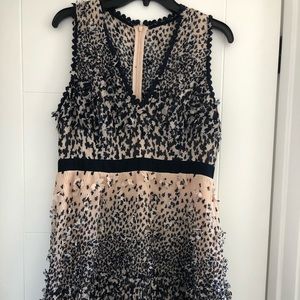 Dress with 3D floral appliqués